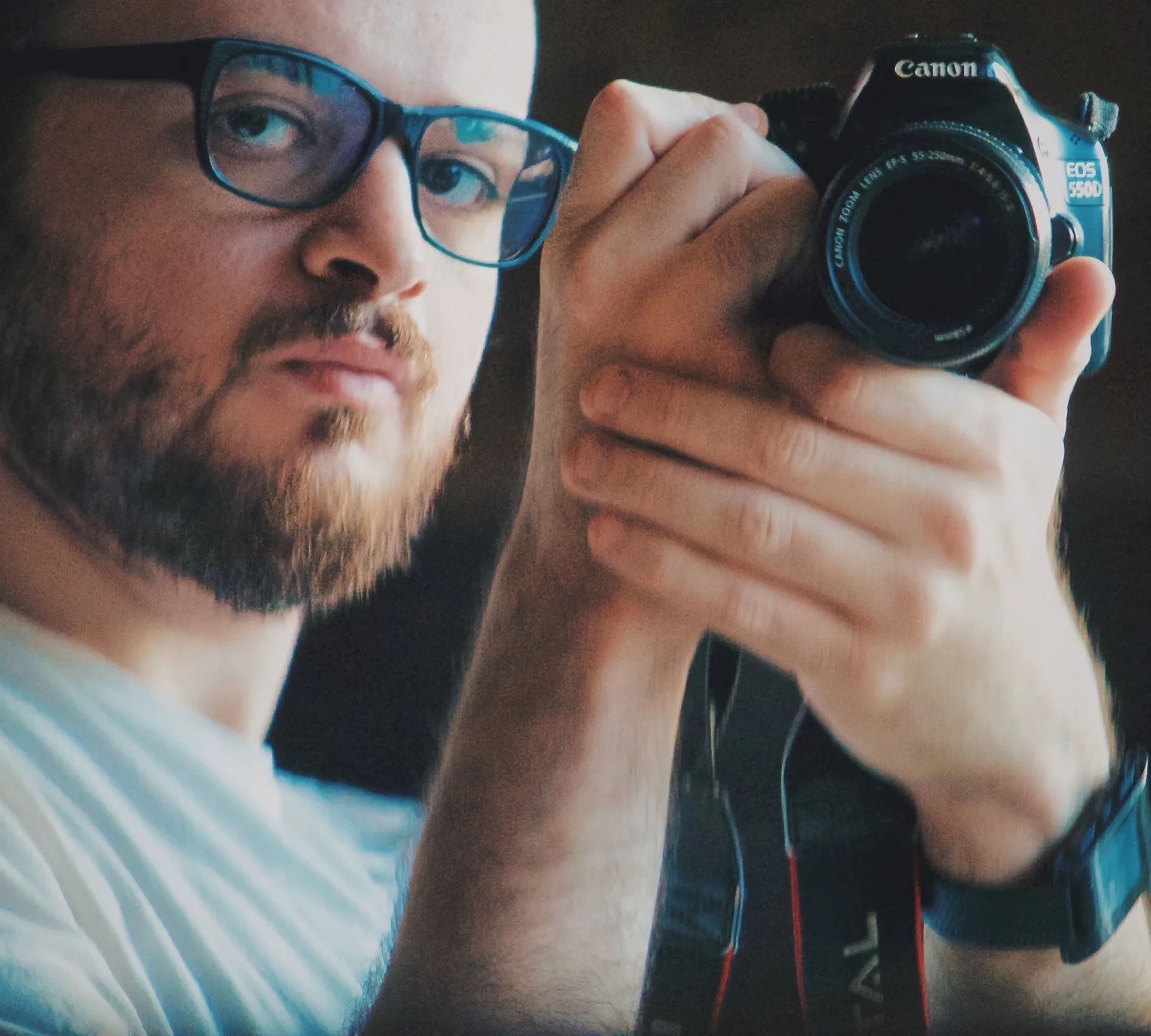 Ahmed holding a camera